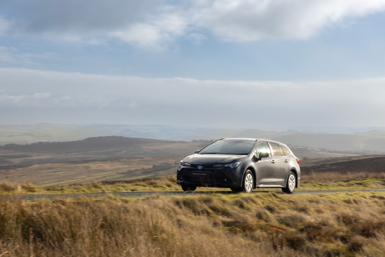 Toyota Corolla Commercial driving on road