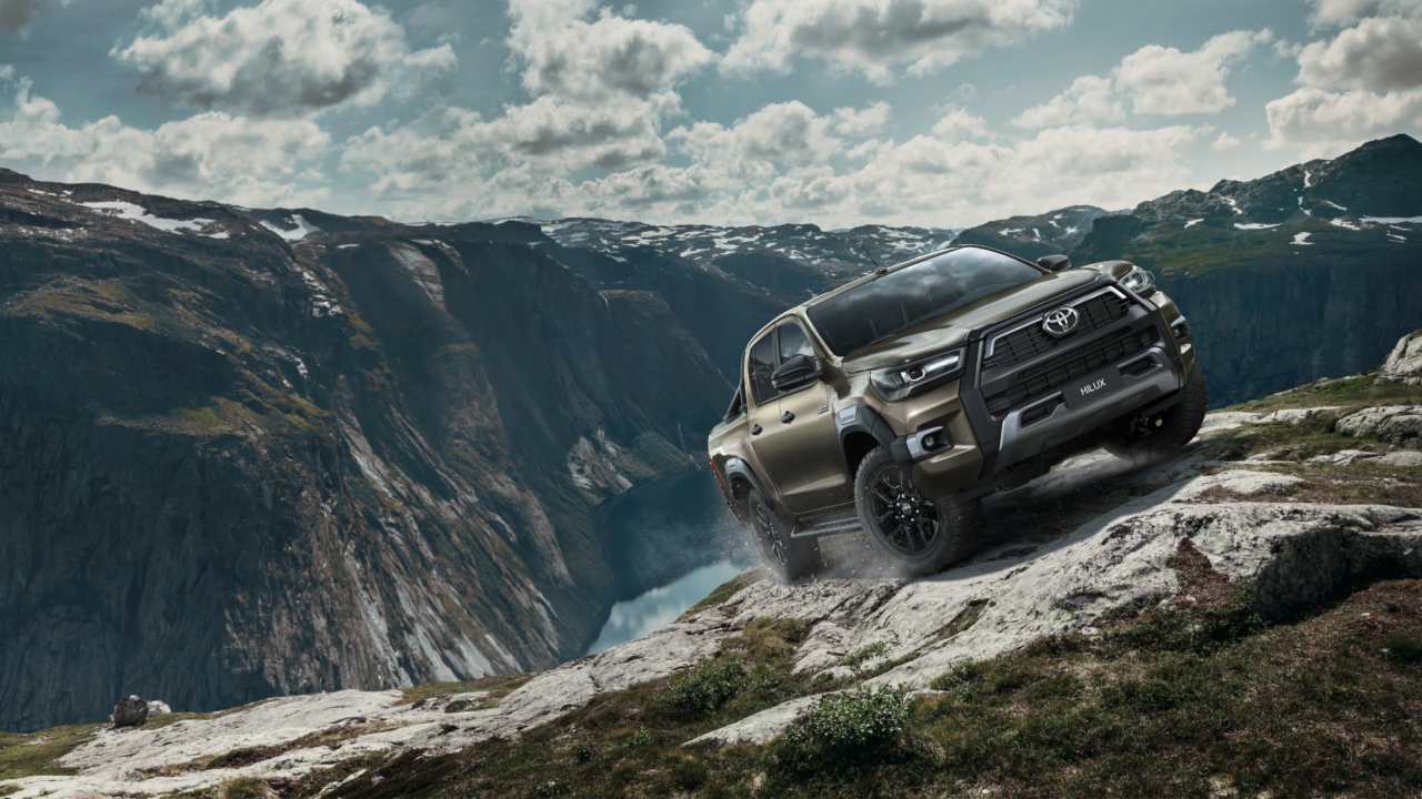 Toyota Hilux driving up a mountain